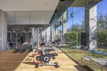 Indoor & outdoor fitness center with cardio, strength training, free weights, stretching, yoga & outdoor fitness area